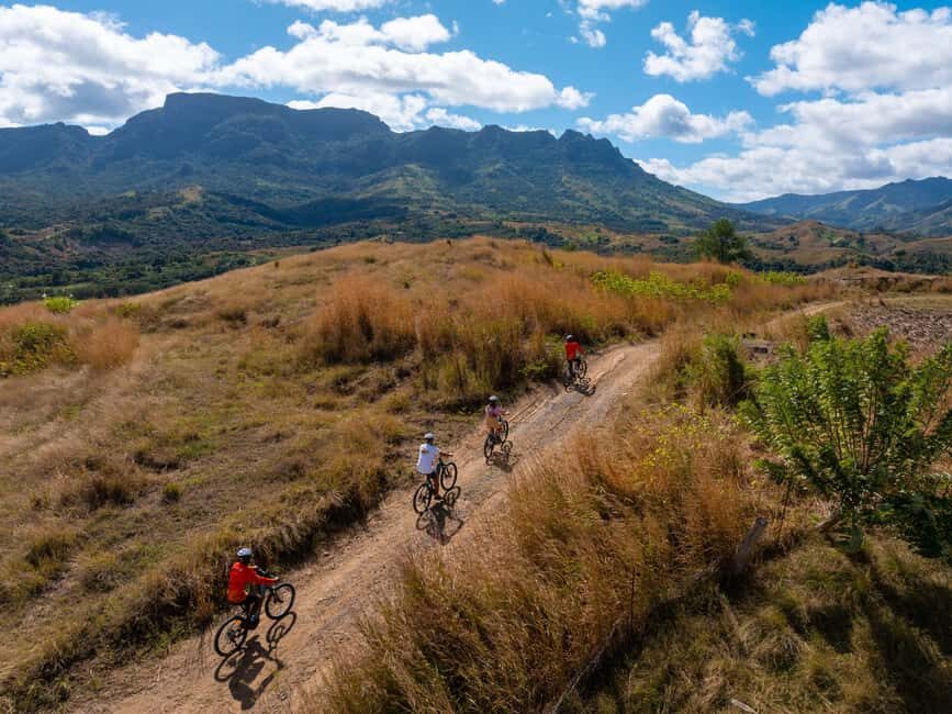 Off-road E-bike Tour with Local Guides - The halfway break: coconut water, local fruit, and Nadi Bay panorama