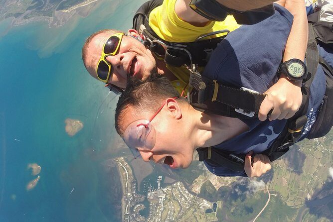 Skydive Fiji Radical 10000ft Tandem Jump (30 seconds free fall) - Under-canopy serenity: coral reefs, white sand, and clear blue water